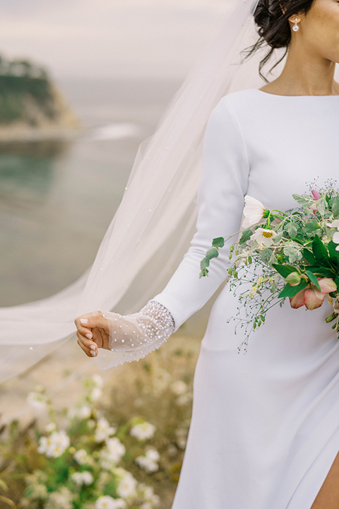  modern black and white upscale wedding on the cliffs overlooking the ocean – bride in long gown 