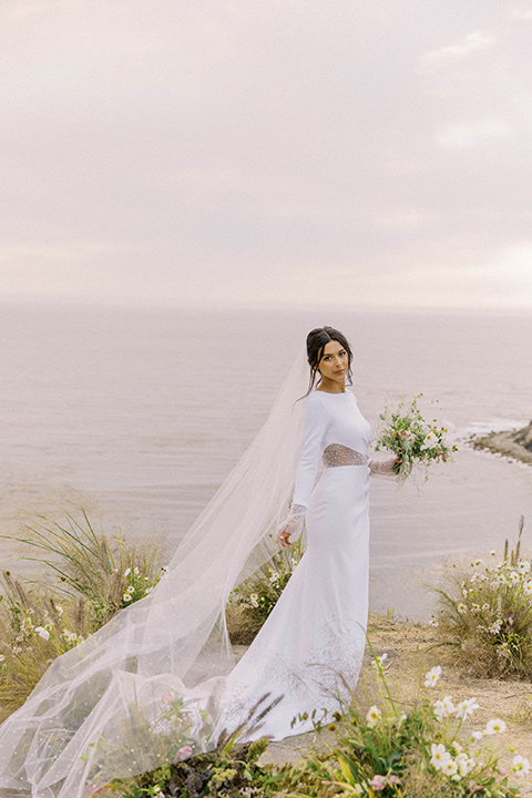  modern black and white upscale wedding on the cliffs overlooking the ocean – bride in long gown 
