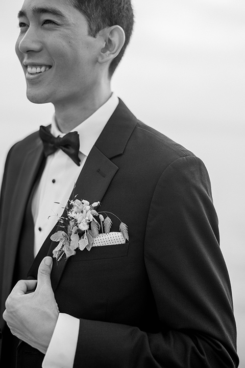  modern black and white upscale wedding on the cliffs overlooking the ocean – groom 