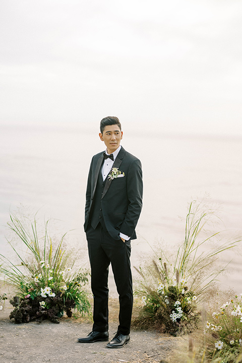  modern black and white upscale wedding on the cliffs overlooking the ocean –  groom 