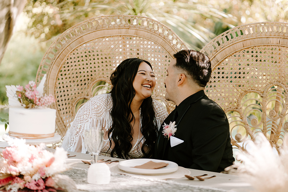  black and white wedding design at the Maxwell House with touches of pink – couple at sweetheart table 