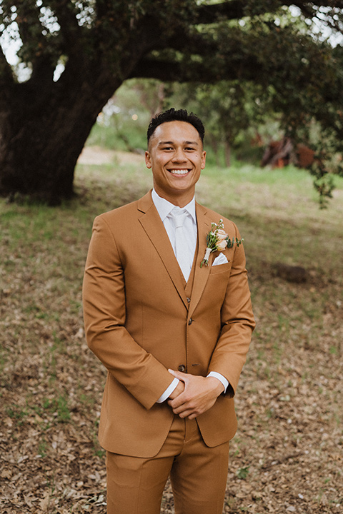  a neutral monochromatic earth toned wedding with boho trendy vibes - groom 