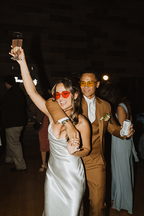  a neutral monochromatic earth toned wedding with boho trendy vibes - couple at reception 