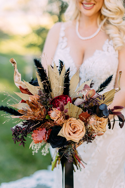 a moody western wedding with burgundy and orange colors - bride 