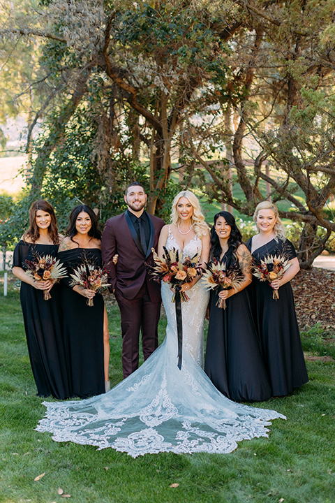  a moody western wedding with burgundy and orange colors - bridesmaids 
