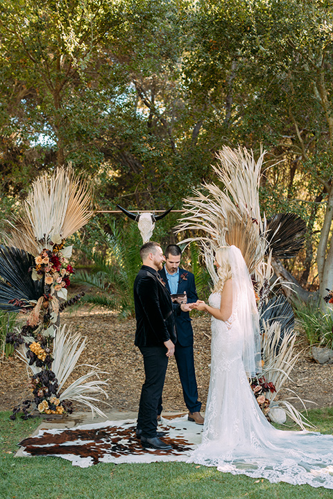  a moody western wedding with burgundy and orange colors - ceremony 