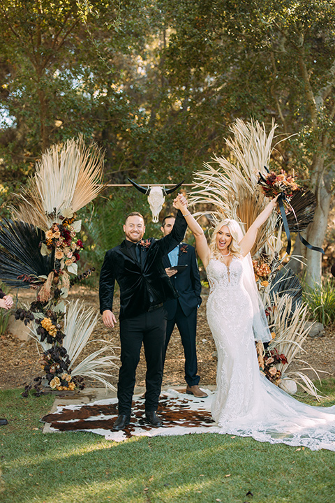  a moody western wedding with burgundy and orange colors - ceremony 
