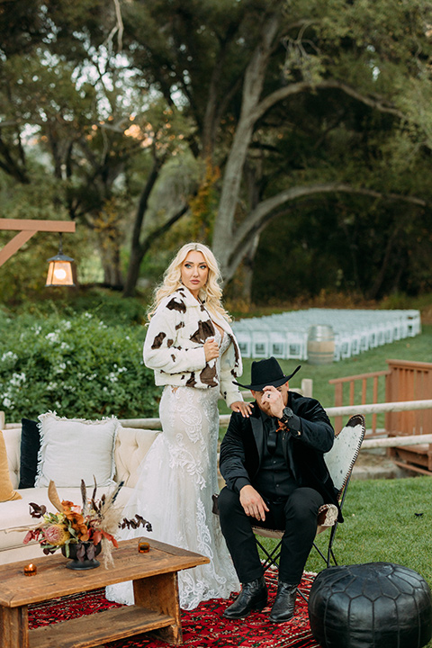  a moody western wedding with burgundy and orange colors - couple in western wear 