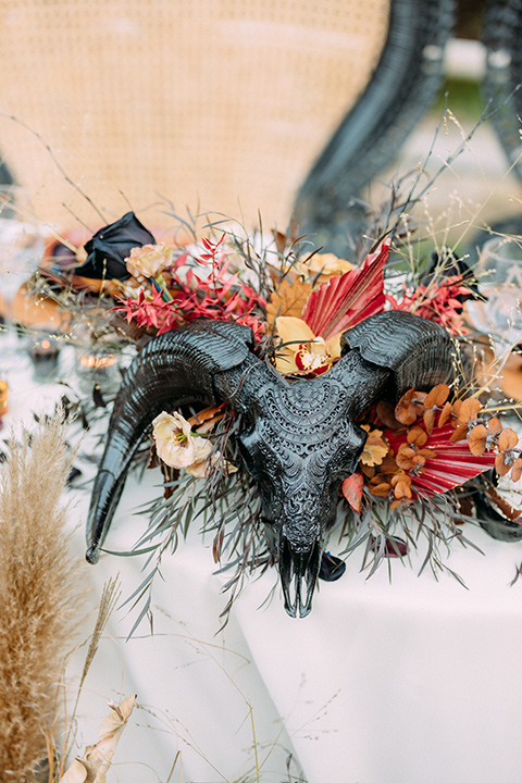  a moody western wedding with burgundy and orange colors - reception décor 