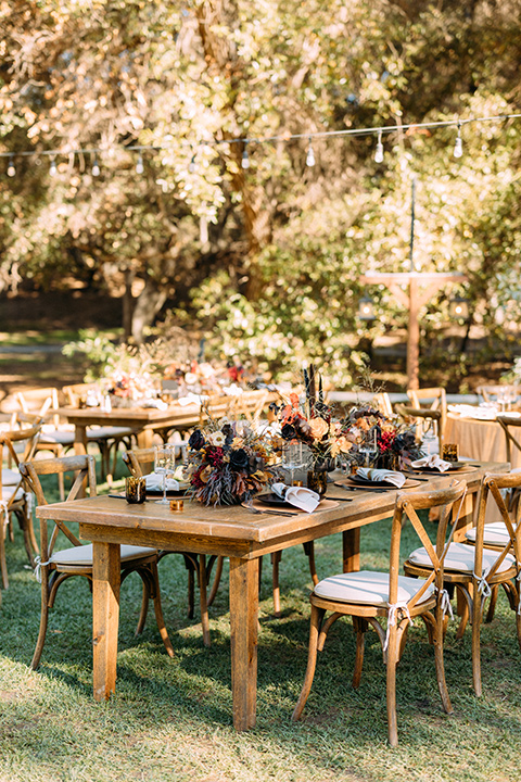  a moody western wedding with burgundy and orange colors - reception décor 