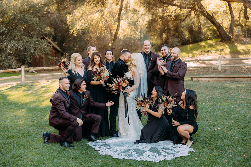  a moody western wedding with burgundy and orange colors – wedding party 
