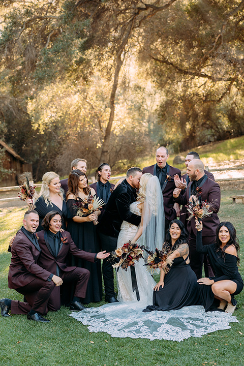  a moody western wedding with burgundy and orange colors - wedding party 