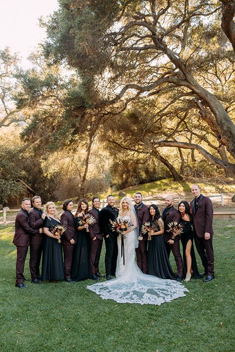  a moody western wedding with burgundy and orange colors - wedding party 