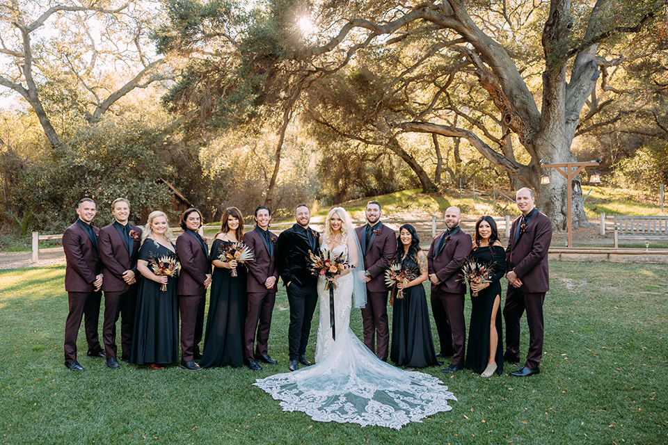  a moody western wedding with burgundy and orange colors – wedding party 