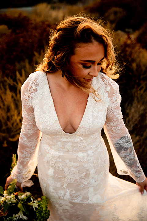  newport wedding in the cliffs with the bride in a lace gown and the groom in a navy blue suit – bride