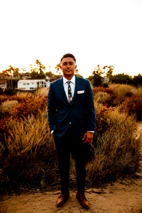  newport wedding in the cliffs with the bride in a lace gown and the groom in a navy blue suit – groom