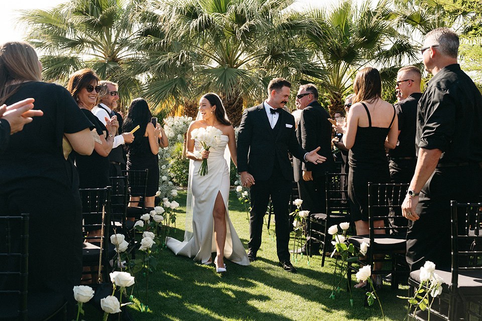 a trendy black and white wedding with modern details - walking down the aisle 