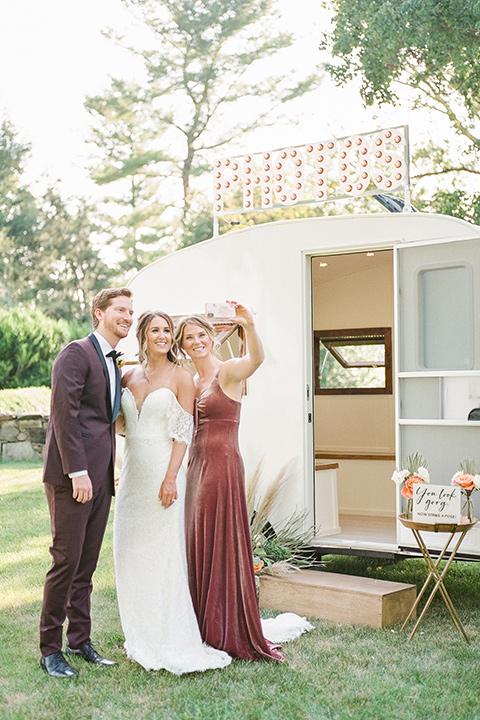  blush and burgundy wedding in the woods with the bride in a boho lace gown, the groom in a burgundy shawl tuxedo, and the bridesmaids in a dusty blush velvet gown – bridalparty