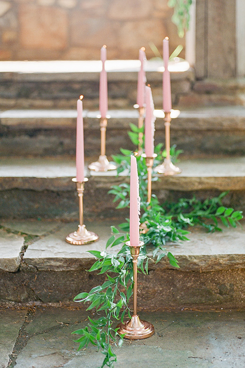  blush and burgundy wedding in the woods with the bride in a boho lace gown, the groom in a burgundy shawl tuxedo, and the bridesmaids in a dusty blush velvet gown – ceremony decor