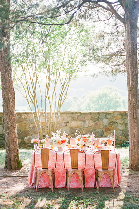  blush and burgundy wedding in the woods with the bride in a boho lace gown, the groom in a burgundy shawl tuxedo, and the bridesmaids in a dusty blush velvet gown – table decor