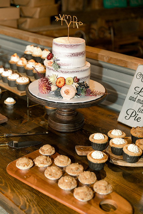  a lavender and black wedding in a garden – with the bride in a long sleeve lace gown and the groom in a black tuxedo – desserts 