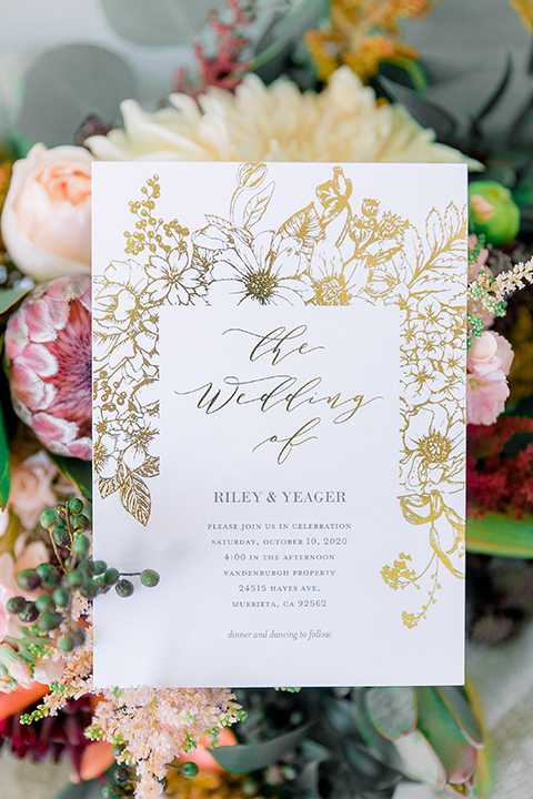  a lavender and black wedding in a garden – with the bride in a long sleeve lace gown and the groom in a black tuxedo – invitations