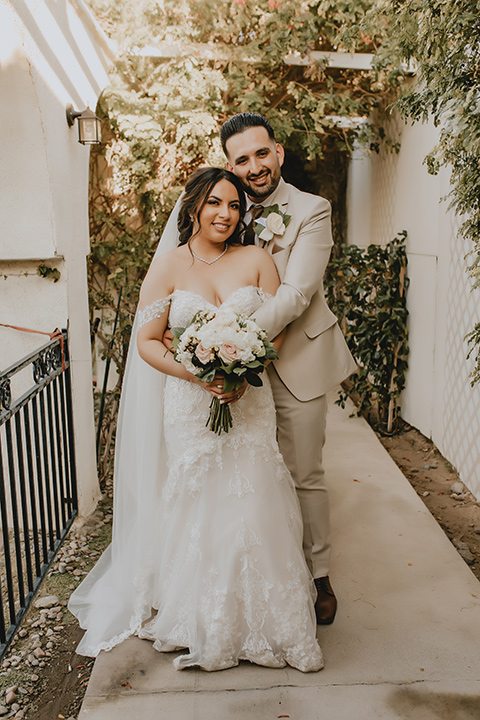  romantic neutral wedding with Spanish flare – couple hugging