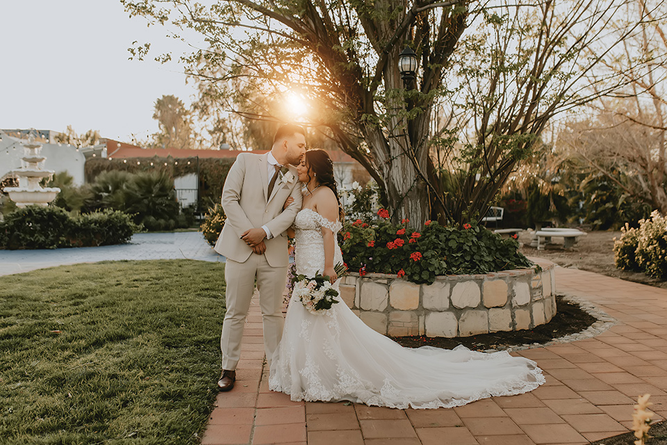  romantic neutral wedding with Spanish flare – couple kissing