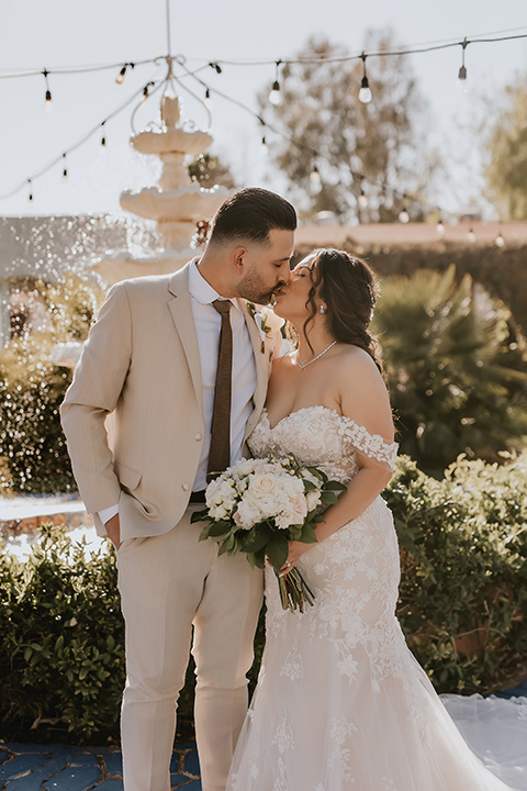  romantic neutral wedding with Spanish flare – couple hugging 