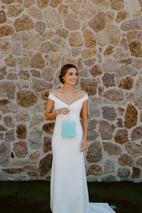  blush and beige wedding with a chic modern twist – the bride in a cap sleeved fitted gown and the groom in a black suit – bride