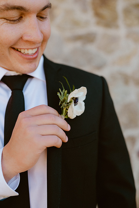  blush and beige wedding with a chic modern twist – the bride in a cap sleeved fitted gown and the groom in a black suit – groom 