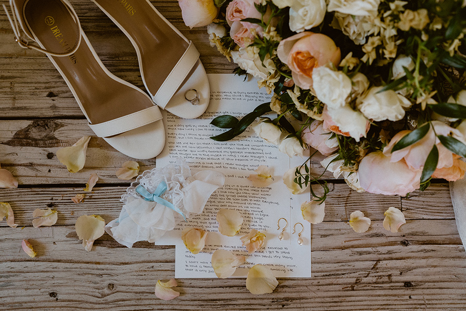  blush and beige wedding with a chic modern twist – the bride in a cap sleeved fitted gown and the groom in a black suit – invitations