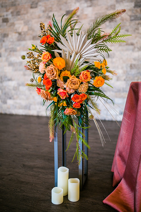  jewel toned wedding with the bride in a ballgown and the groom in a blue velvet tuxedo – florals