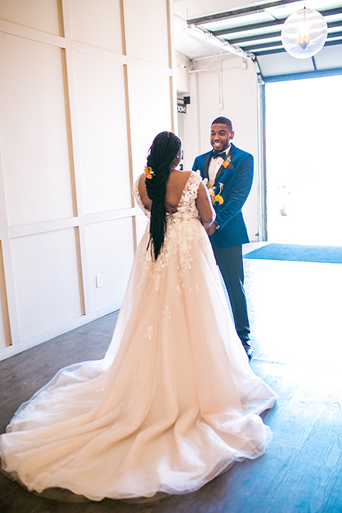  jewel toned wedding with the bride in a ballgown and the groom in a blue velvet tuxedo – first look