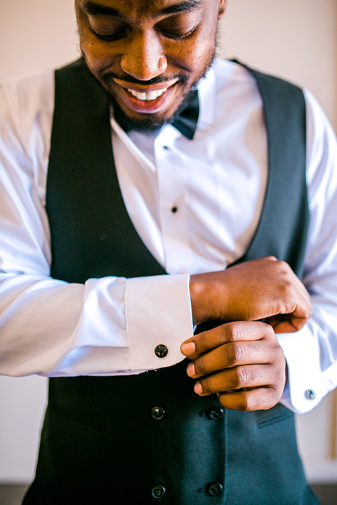  jewel toned wedding with the bride in a ballgown and the groom in a blue velvet tuxedo – groom