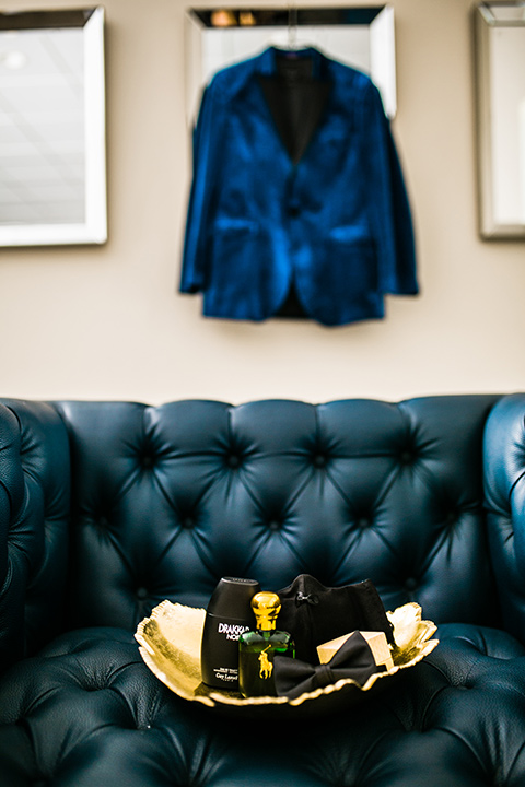  jewel toned wedding with the bride in a ballgown and the groom in a blue velvet tuxedo – groom accessories 