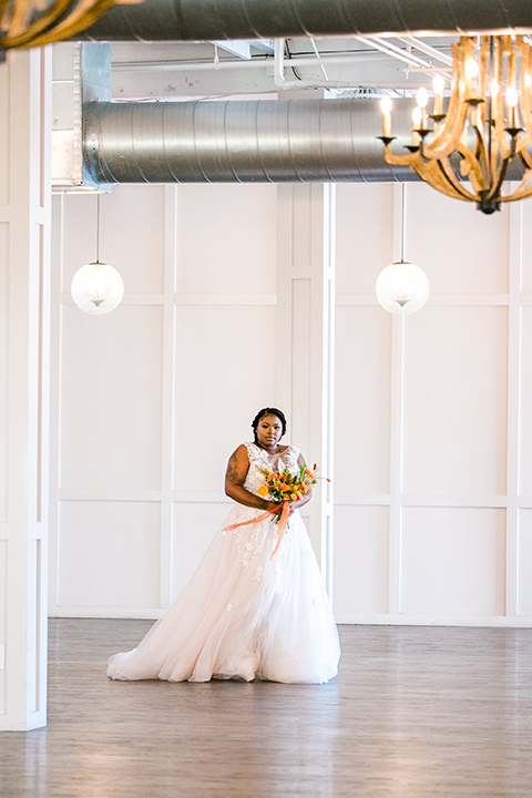  jewel toned wedding with the bride in a ballgown and the groom in a blue velvet tuxedo – walking down the aisle 