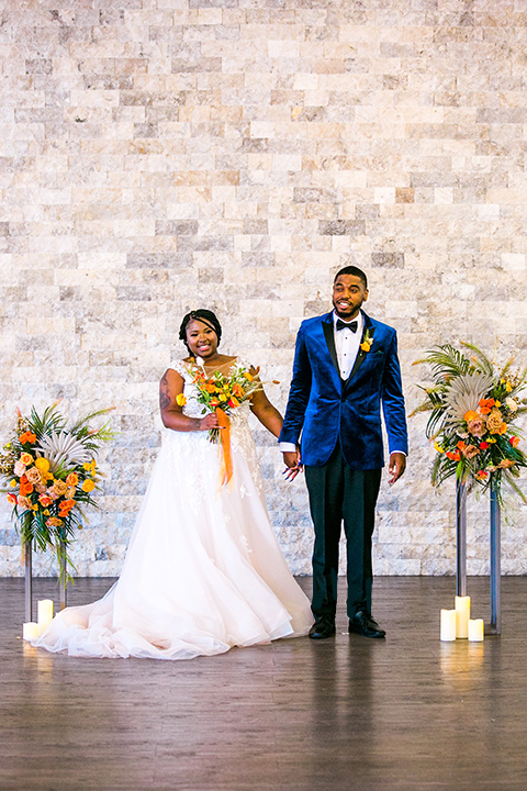  jewel toned wedding with the bride in a ballgown and the groom in a blue velvet tuxedo – ceremony 
