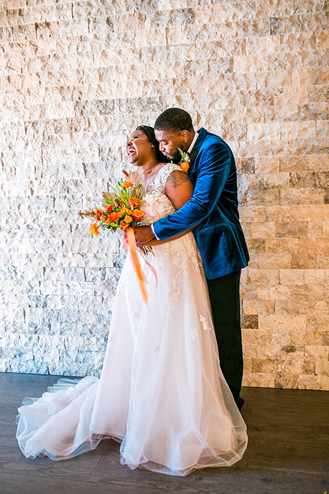  jewel toned wedding with the bride in a ballgown and the groom in a blue velvet tuxedo – first look 