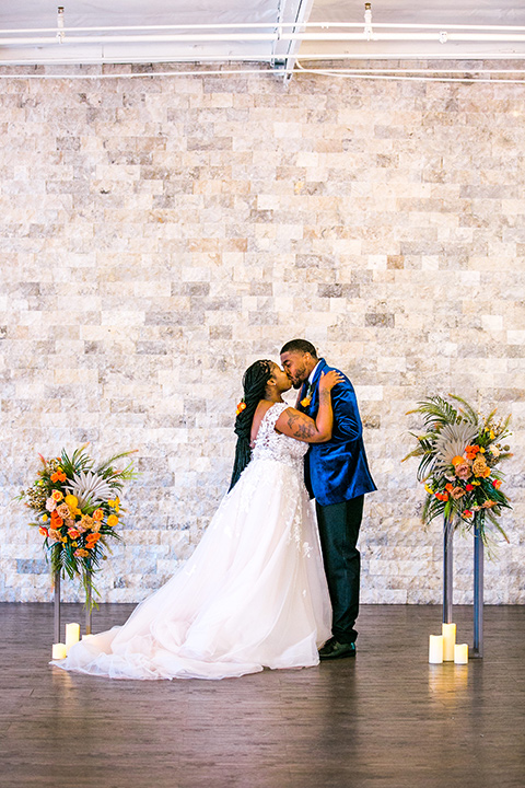  jewel toned wedding with the bride in a ballgown and the groom in a blue velvet tuxedo – ceremony