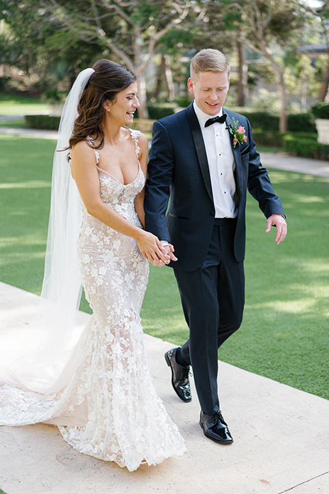  stephanie and blakes wedding at the waldorf with navy and blush décor – couple walking 