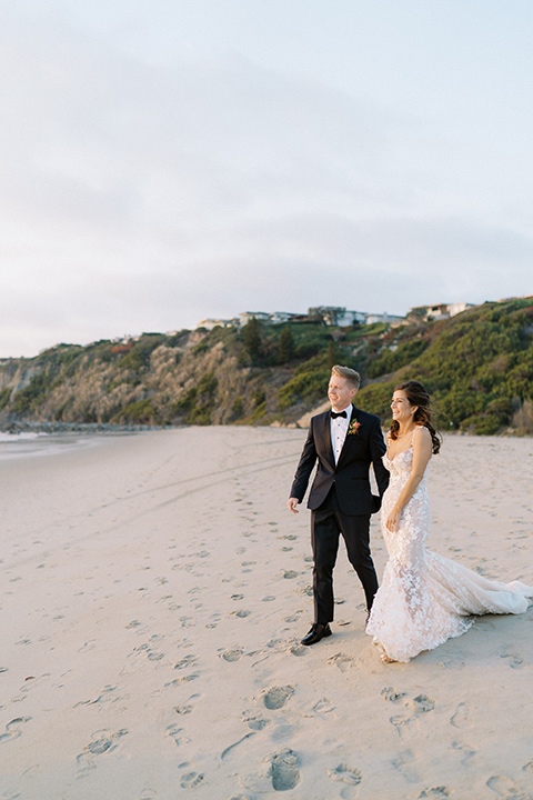  stephanie and blakes wedding at the waldorf with navy and blush décor – couple on the beach