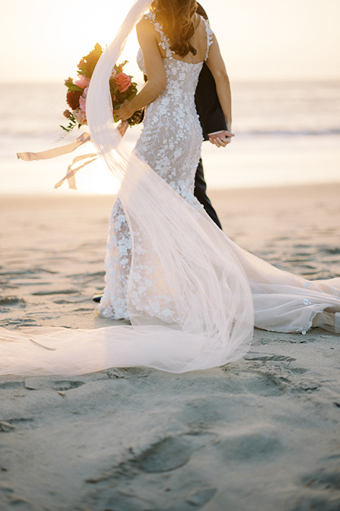  stephanie and blakes wedding at the waldorf with navy and blush décor – couple on the beach