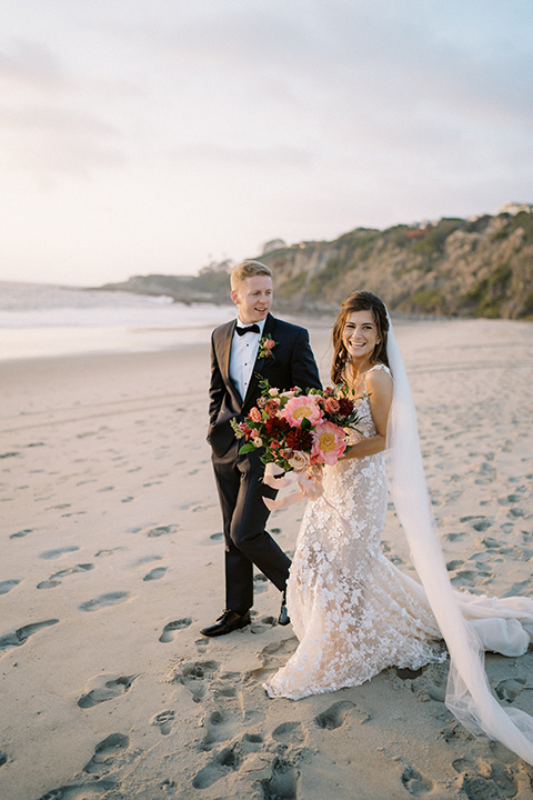  stephanie and blakes wedding at the waldorf with navy and blush décor – couple on the beach 