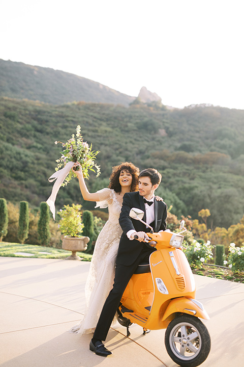  classic black tie wedding at the stone mountain estate – couple on vespa