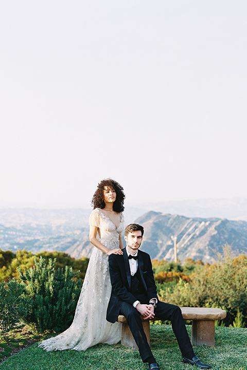  classic black tie wedding at the stone mountain estate – couple by the hedges 