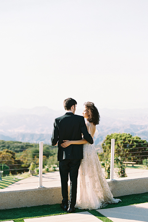  classic black tie wedding at the stone mountain estate – couple hugging 