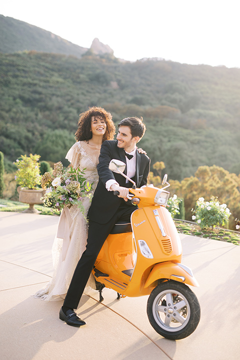  classic black tie wedding at the stone mountain estate – couple on vespa 