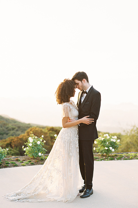  classic black tie wedding at the stone mountain estate – couple walking 