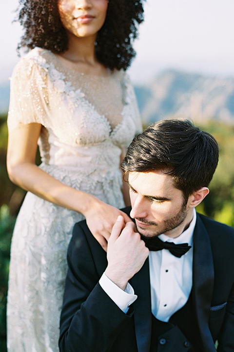  classic black tie wedding at the stone mountain estate – couple by the hedges 